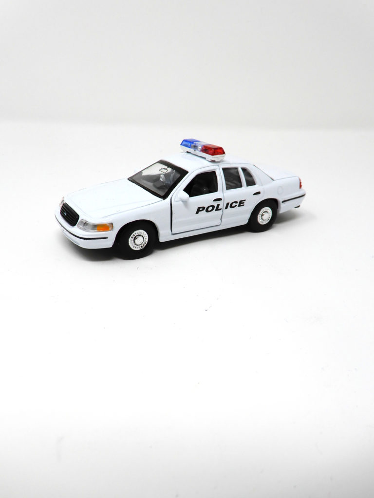 toy police car with policeman